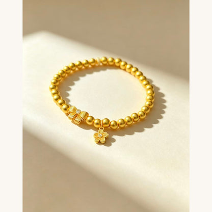 Gold Bead Bracelet with Bow & Flower Charm