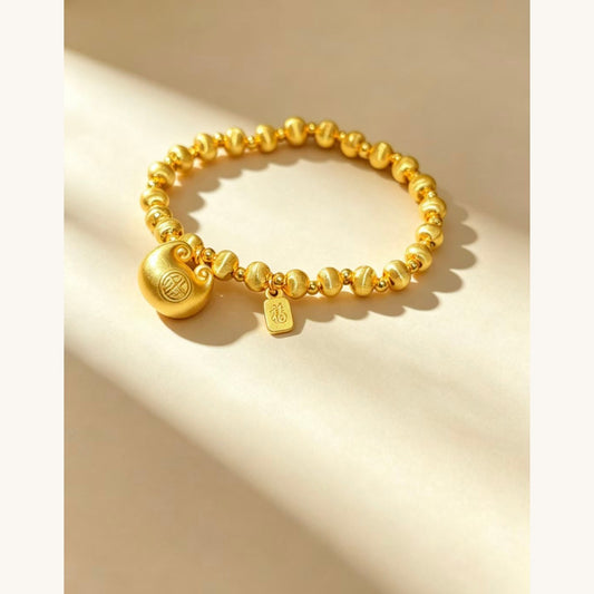 Gold Beaded Bracelet with Charm