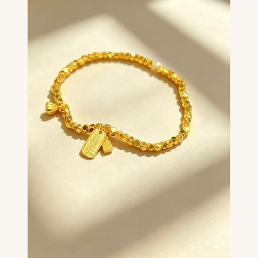 Gold Beaded Bracelet with Ribbon Charm