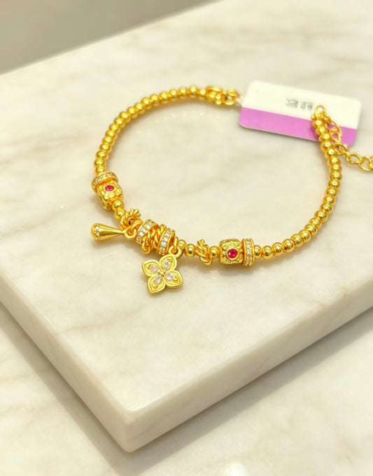 Gold Beaded Bracelet with Butterfly Charm