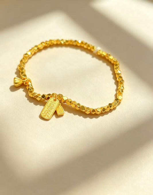 Gold Beaded Bracelet with Ribbon Charm
