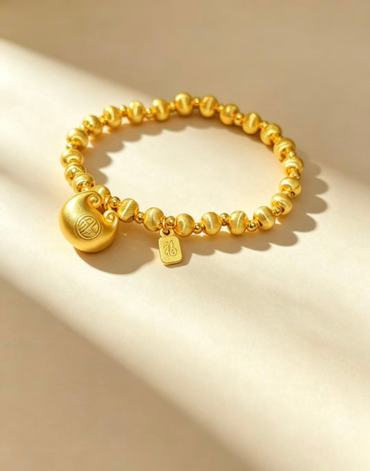 Gold Beaded Bracelet with Charm