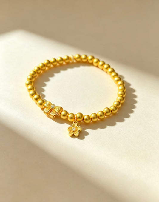 Gold Bead Bracelet with Bow & Flower Charm